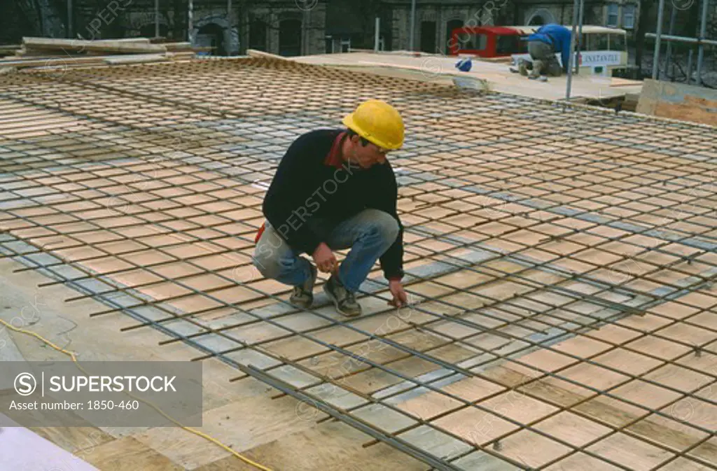 Architecture, Construction, Workman Laying Reinforcing Steel For Flooring