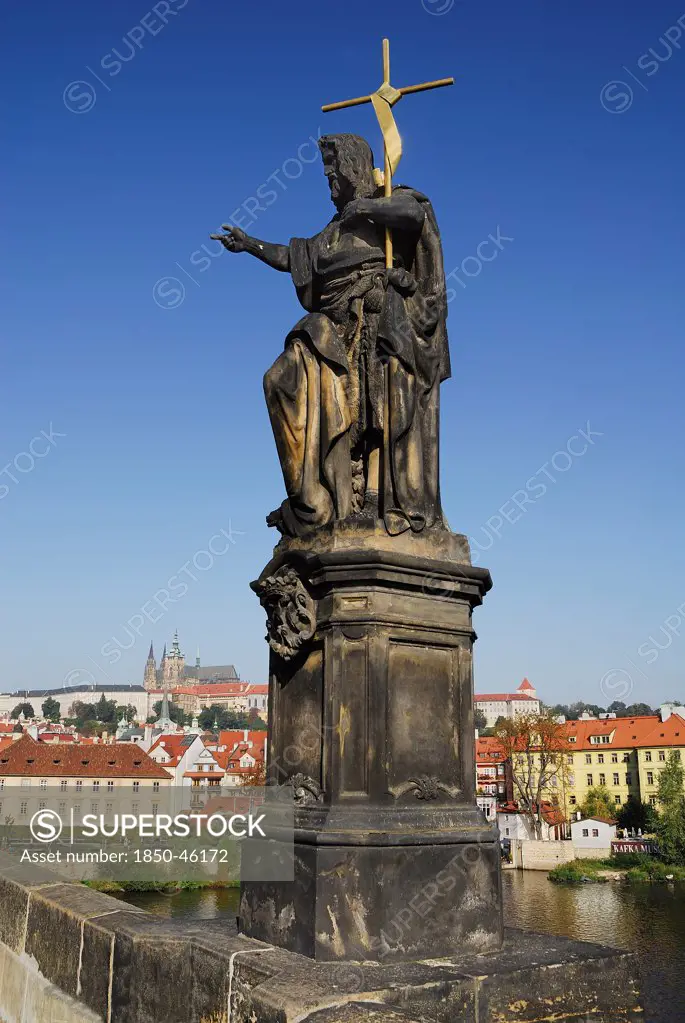 Czech Republic, Bohemia, Prague, Charles Bridge, Statue of John the Baptist with St Vitus.