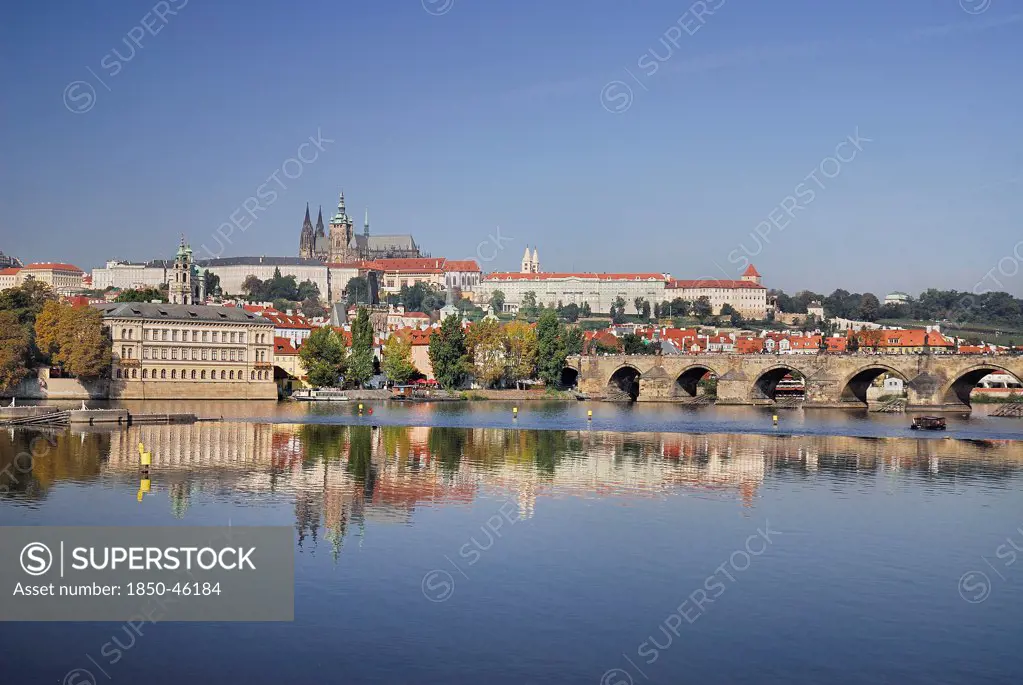 Czech Republic, Bohemia, Prague, Charles Bridge and St Vitus seen from bank of River Vltava.