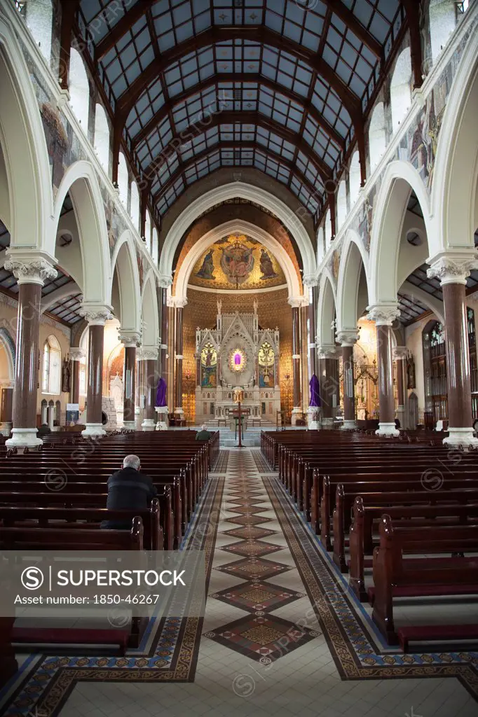 Ireland, North, Belfast, Falls Road, Clonard Monastery interior decorated for Good Friday with statues draped in purple cloth.