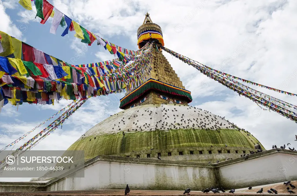 Nepal, Boudhanath Stupa near Kathmandu, with coloutful prayer flags.