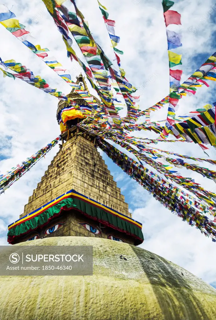 Nepal, Boudhanath Stupa near Kathmandu, with coloutful prayer flags.