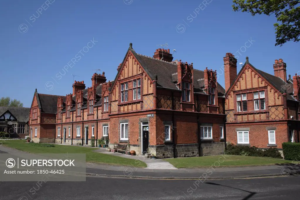 England, Merseyside, The Wirral, Port Sunlight, Red brick terraced houses on Cross street.