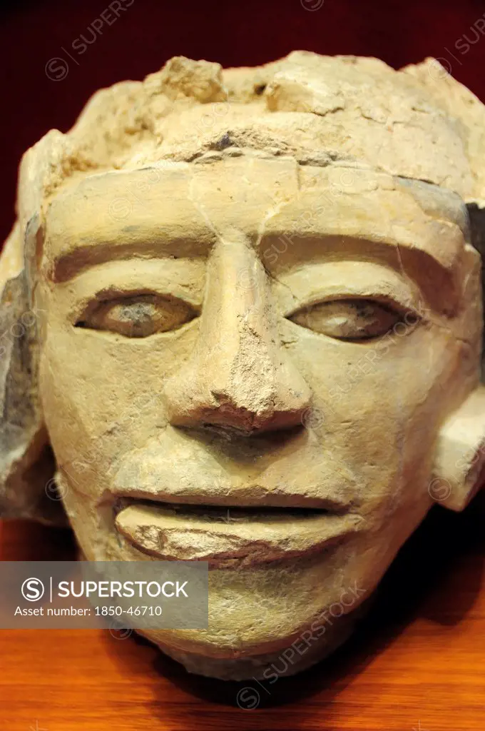 Mexico, Veracruz, Papantla, Carved stone human head 900-1150 AD El Tajin archaeological site museum.