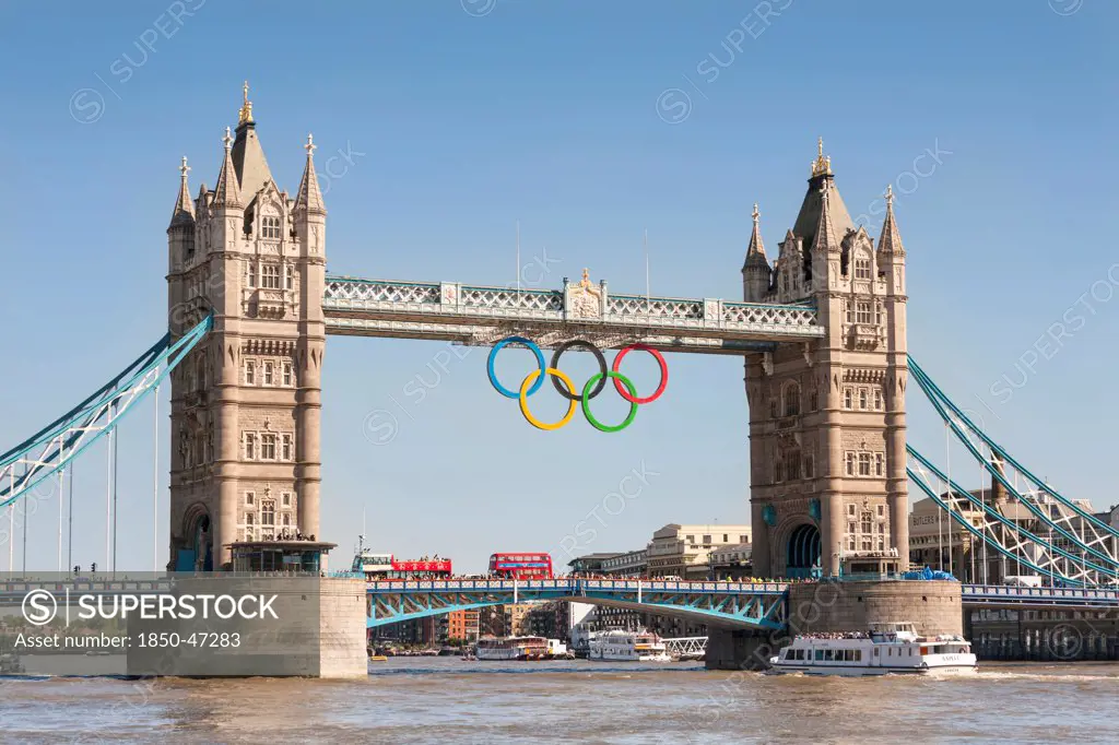 England, London, The Olympic rings celebrating the 2012 Olympic Games suspended from Tower Bridge.