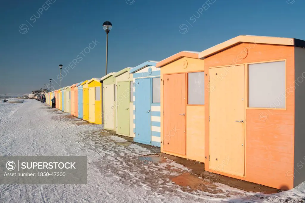 England, East Sussex, Seaford, Beach Huts in the snow.