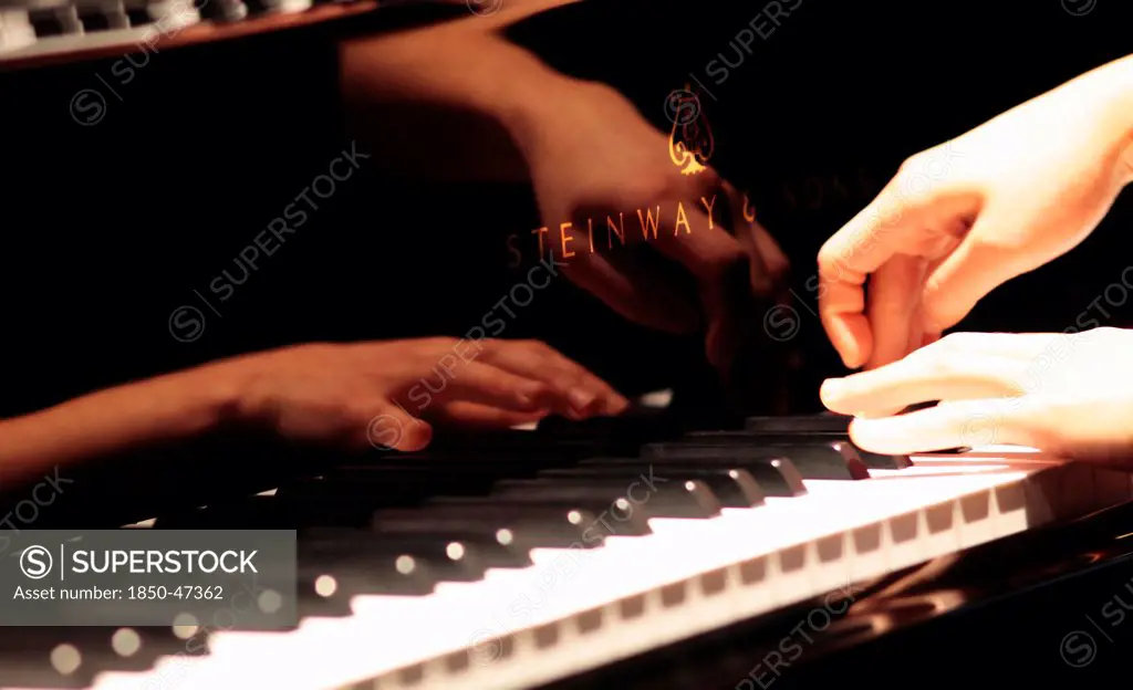 Music, Instruments, Keyboards, Piano Close of of musicians hands playing Steinway.
