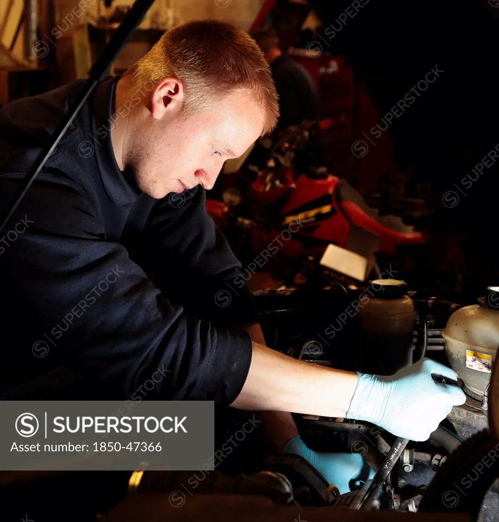 Transport, Road, Cars, Repair mechanic working on car in garage.