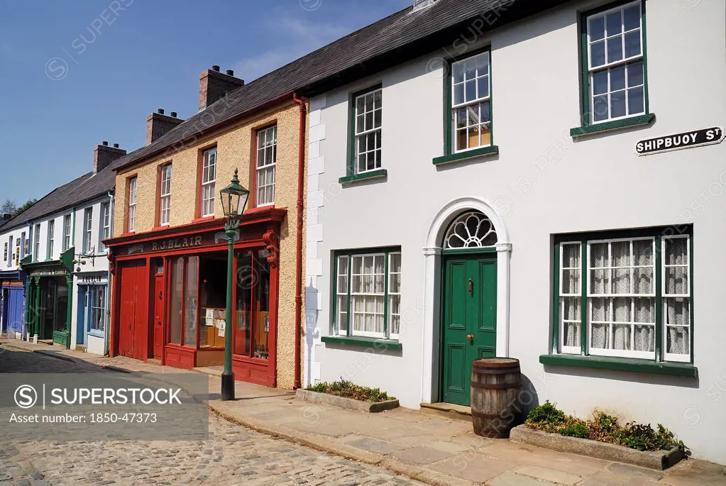 Ireland, County Tyrone, Omagh, Ulster American Folk Park 19th century street with Victorian shopfronts.