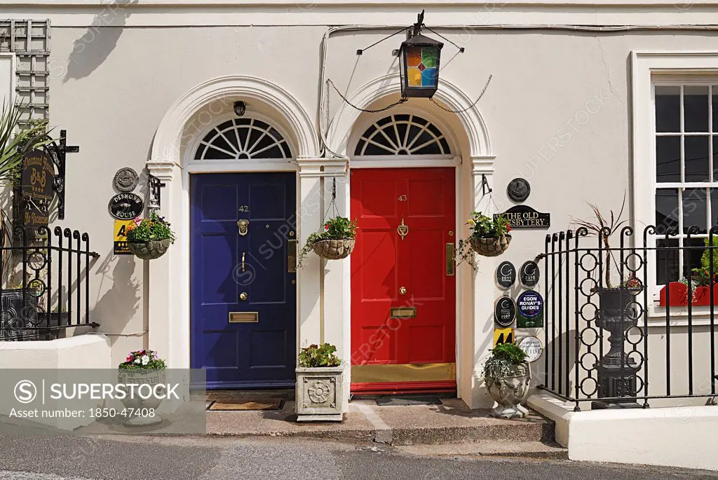 Ireland, County Cork, Kinsale, Colourful doorways of terraced houses.