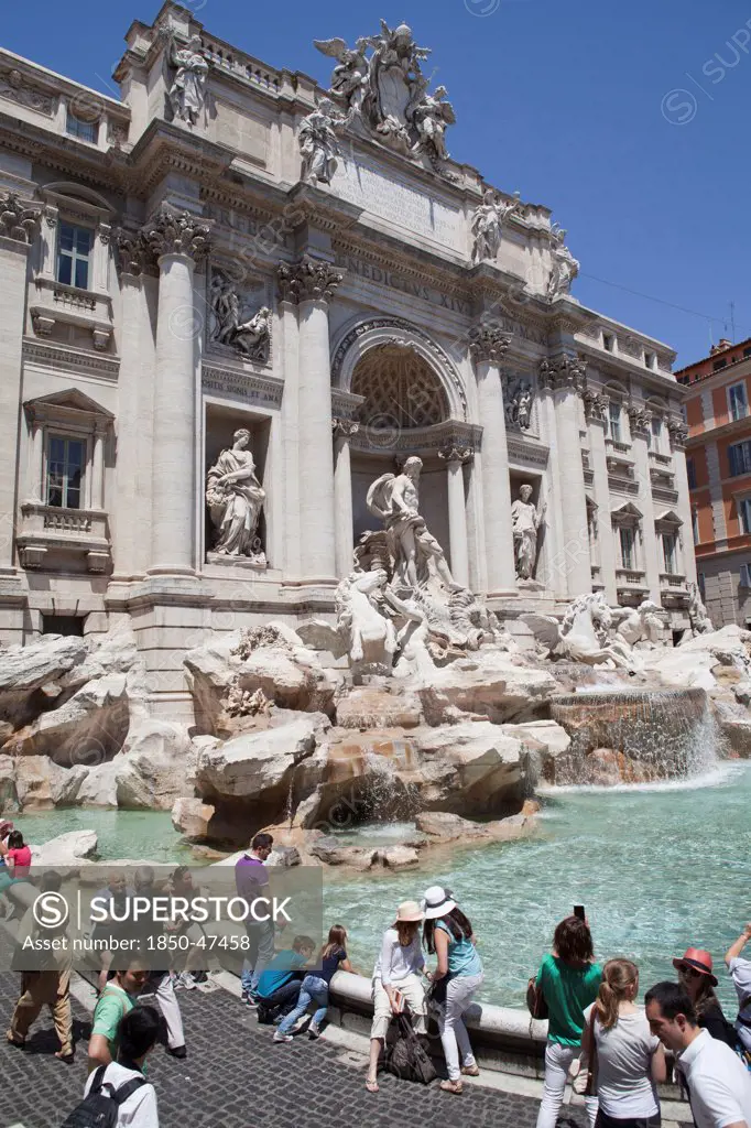 Italy, Lazio, Rome, Piazza di Trevi the baroque Trevi Fountain by Nicola Salvi 1762 against the Palazzo Poli.