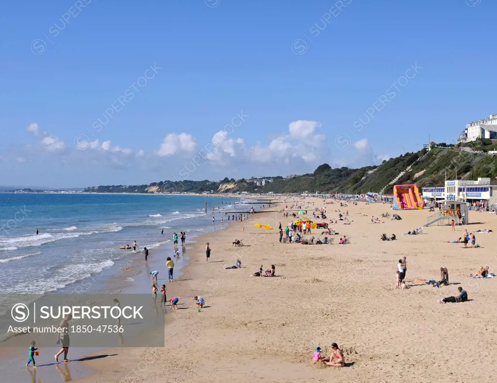 England, Dorset, Bournemouth, View over beach with families sunbathing and Life Guard station.