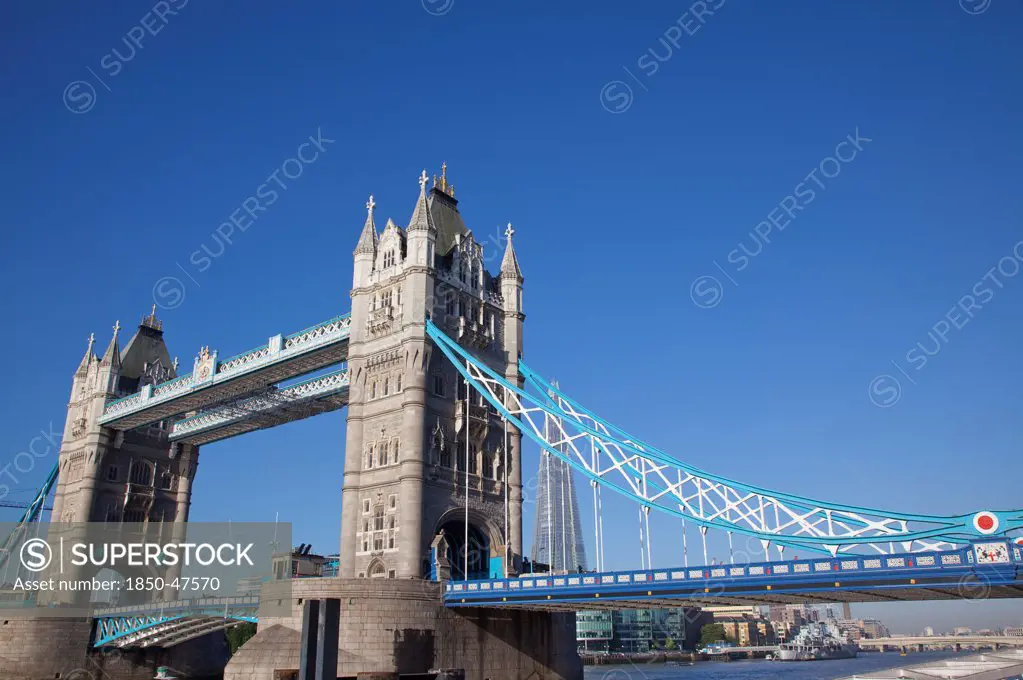 England, London, Tower Bridge with HMS Belfast visible.