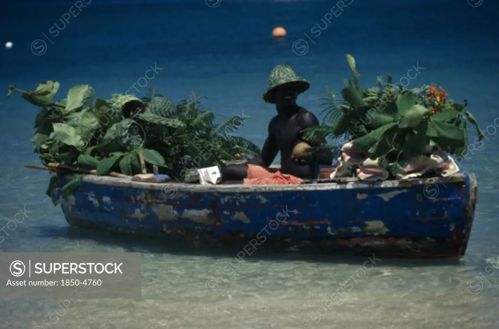 West Indies, St Lucia,  Reduit Beach, Beach Vendor Selling Fruit From Boat