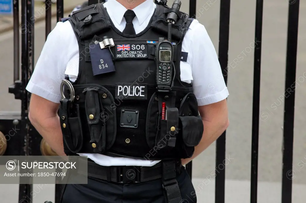 England, London, Detail of Police stab proof vest with various accessories.