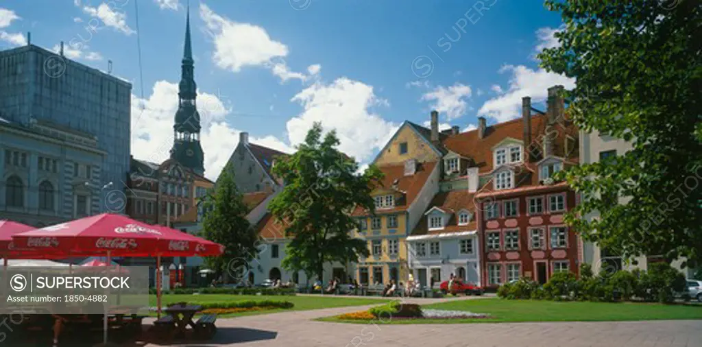 Latvia, Riga, City Centre Square With Outdoor Cafe In The Foreground