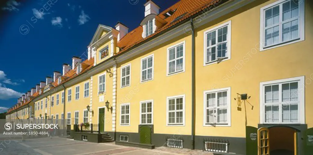 Latvia,  , Riga, Swedish Gate. Row Of Bright Yellow Terraced Houses