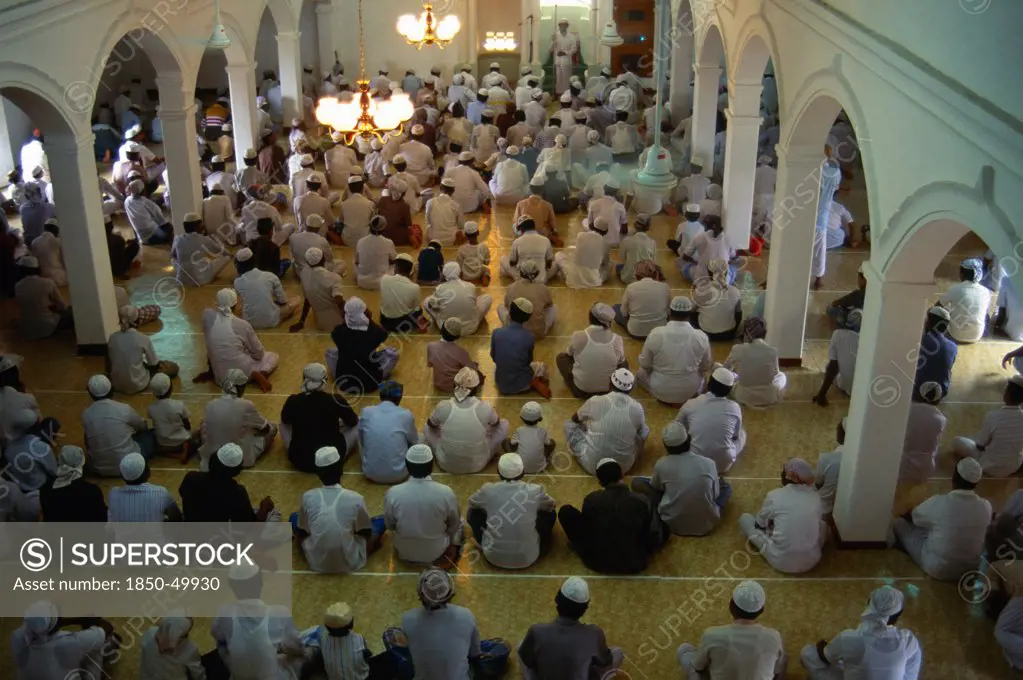 Sri Lanka, Negombo, Men at prayer inside mosque.