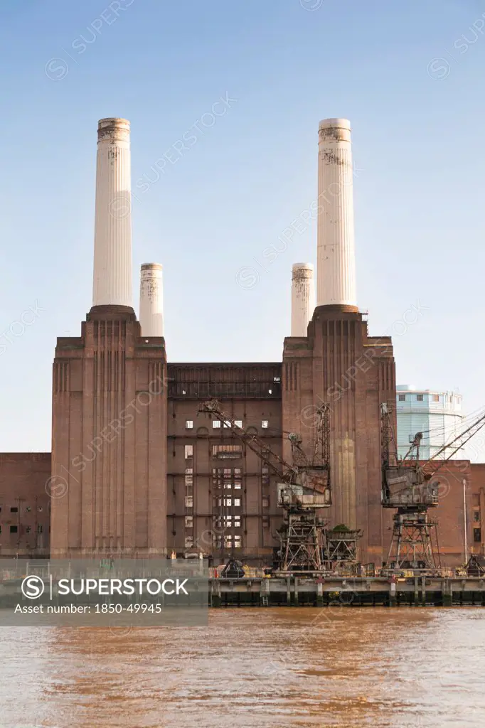 England, London, Battersea Power Station beside the River Thames.