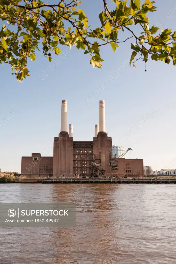 England, London, Battersea Power Station beside the River Thames.