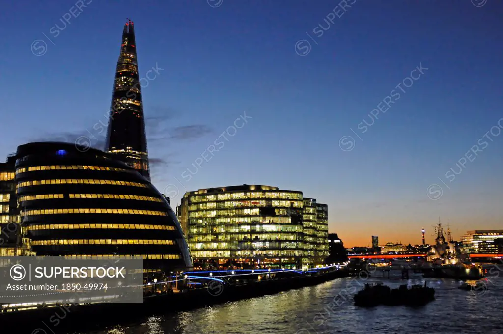 England, London, Southwark River Thames with The Shard and City Hall at night.