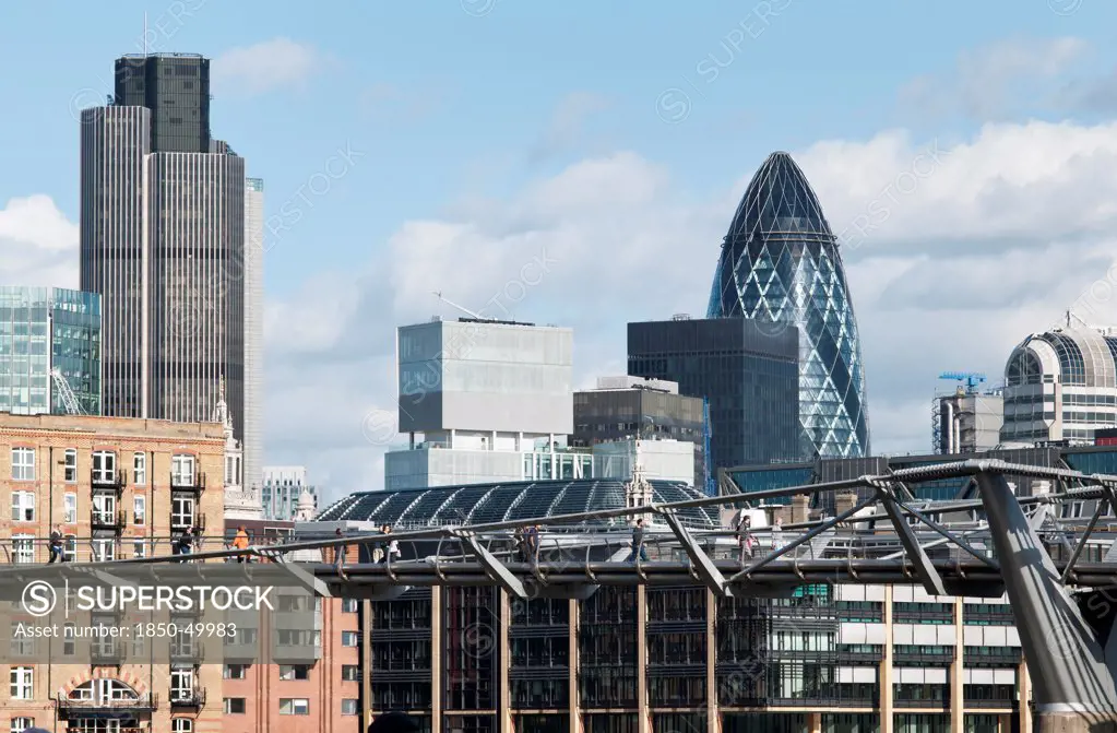 England, London, The City of London financial centre and the Millenium bridge.