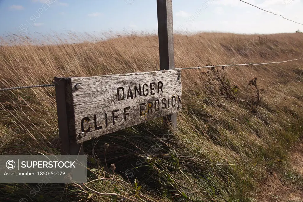 England, East Sussex, Beachy Head, Sign warning of cliff erosion.