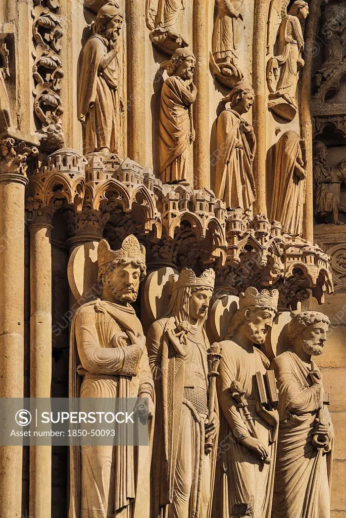 France, Ile de France, Paris, Notre Dame cathedral detail of carvings around the entrance.