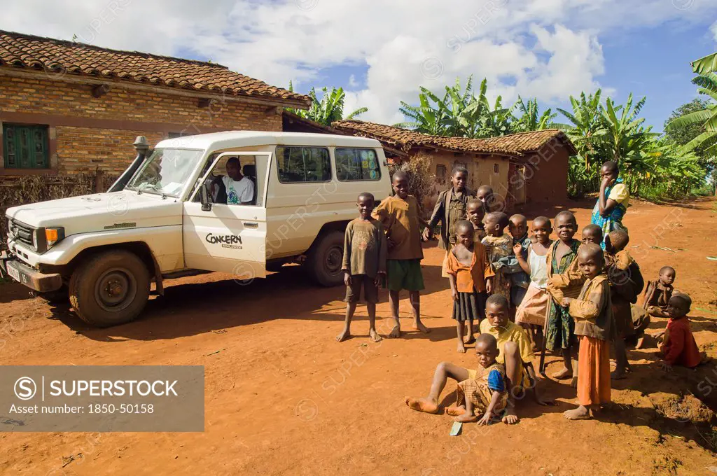 Rwanda, Children, Group of children on road beside a development project vehicle
