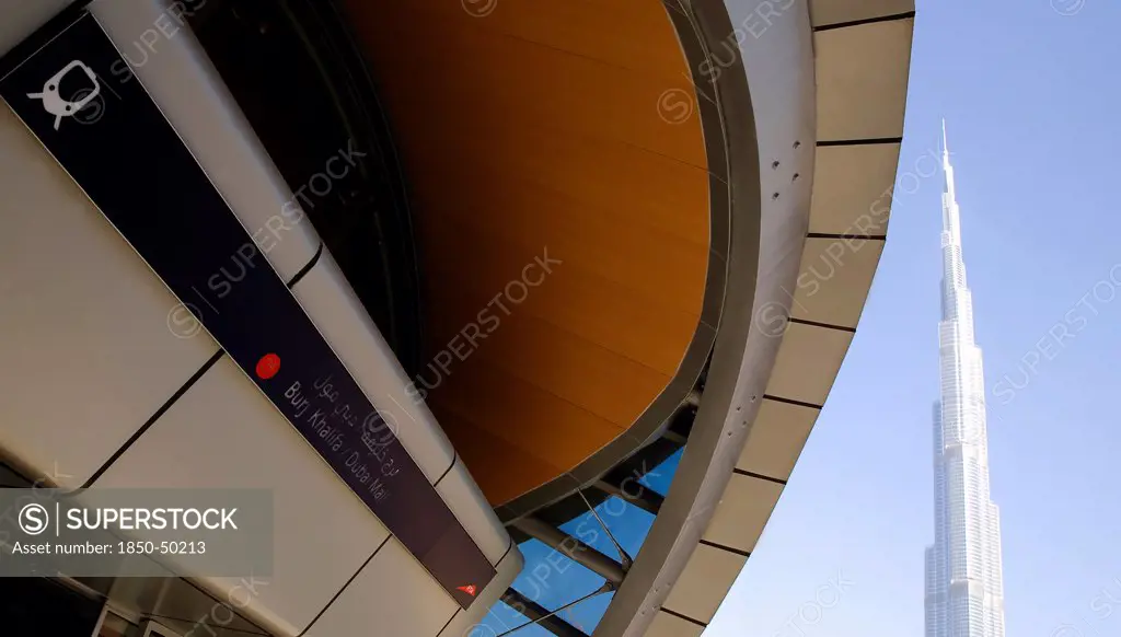 UAE, Dubai, Metro station entrance in front of Burj Khalifa tower.