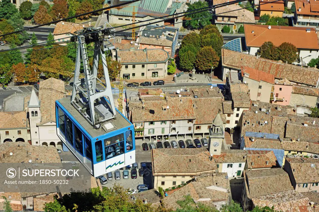 Republic of San Marino, San Marino City, Aerial Cable Car ride over city rooftops during the ascent to Monte Titano.