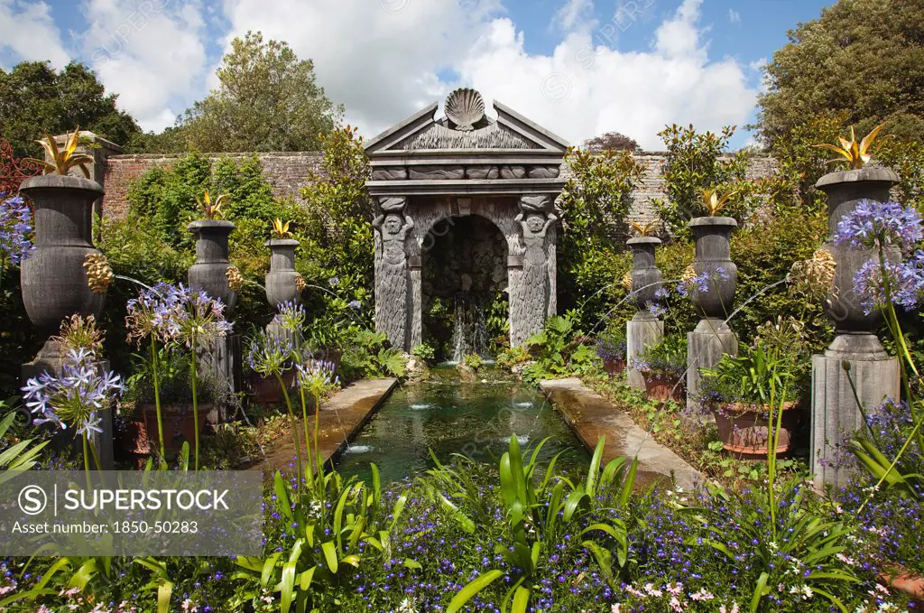 Plants, Flowers, Agapanthus, Formal garden with pool fountains and Agapanthus planted in the foreground.