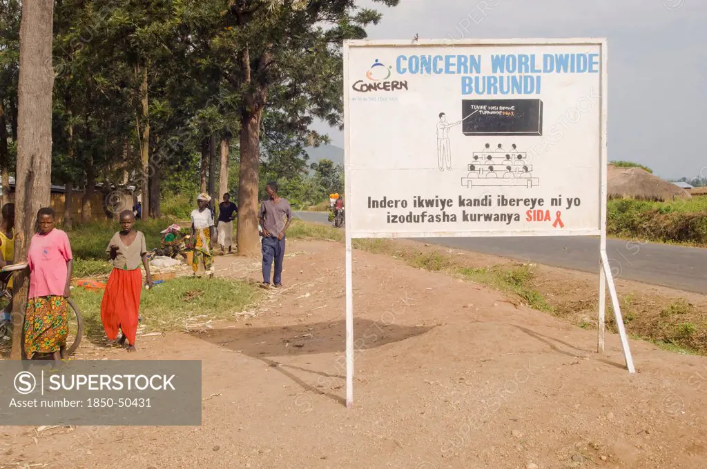 Burundi, Cibitoke Province, Buganda, Ndava Village Sign board beside the main road in Buganda Commune with HIV AIDS SIDA message.