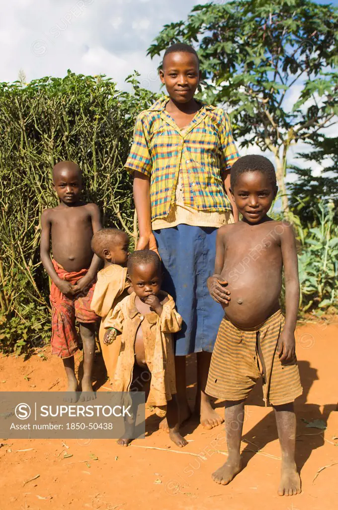 Burundi, Cibitoke Province, Kirundo, A family beside the road living in poverty child with obvious worms.