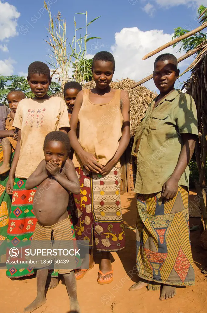 Burundi, Cibitoke Province, Kirundo, A family beside the road living in poverty child with obvious worms.