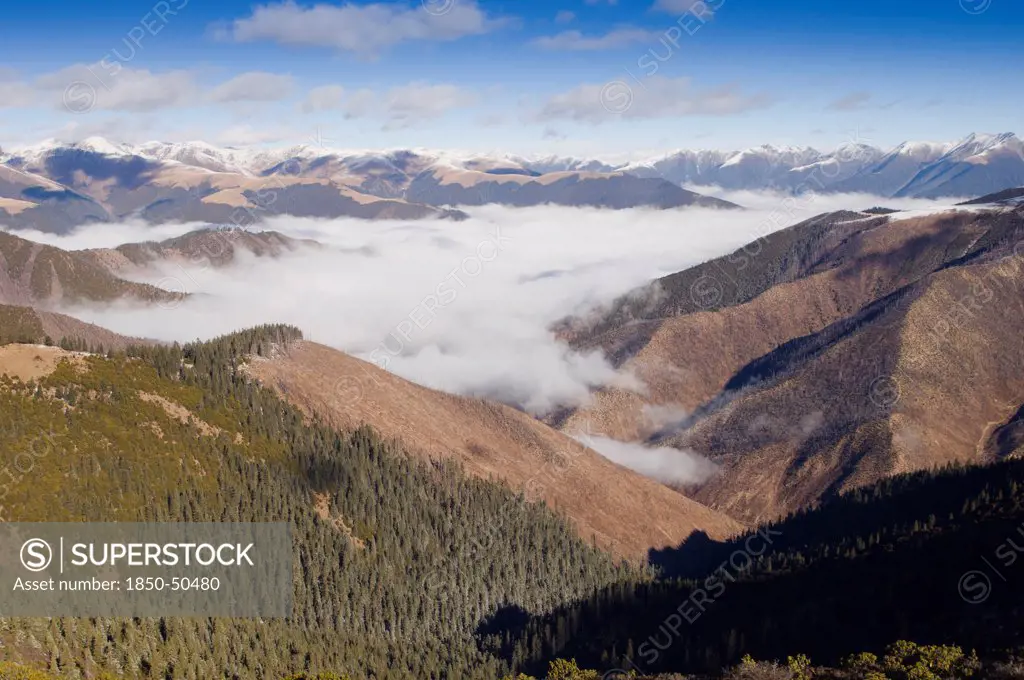 China, Szechuan Province, Tibet, High altitude view across mountains and valleys in Tibetan region of Litang county.