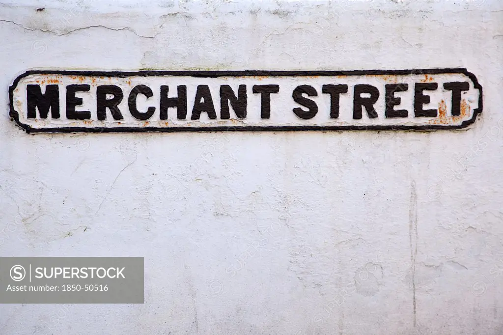 England, West Sussex, Bognor Regis, Old cast iron road sign for Merchant Street.