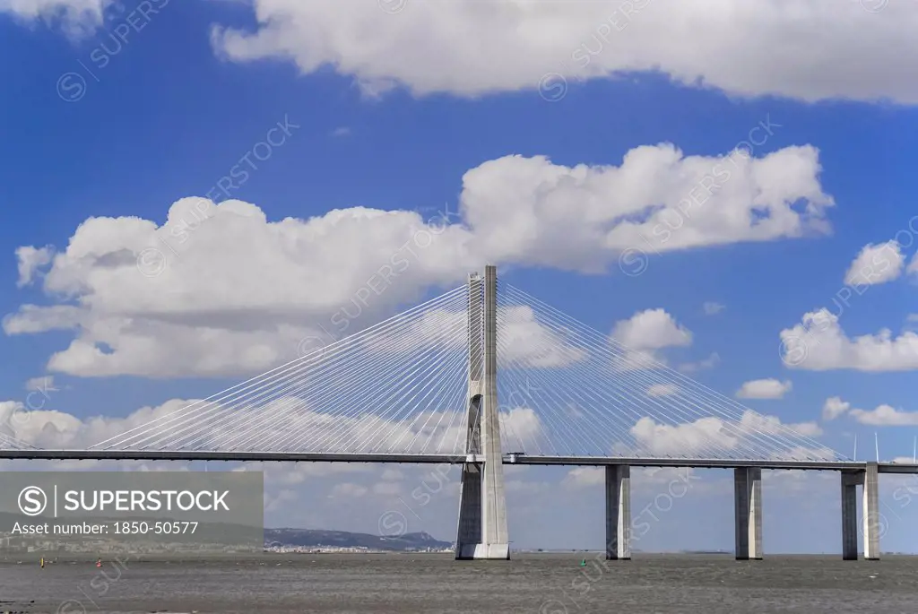 Portugal, Estremadura, Lisbon, Vasco da Gama suspension bridge over the river Tejo seen from Parc das Nacoes.