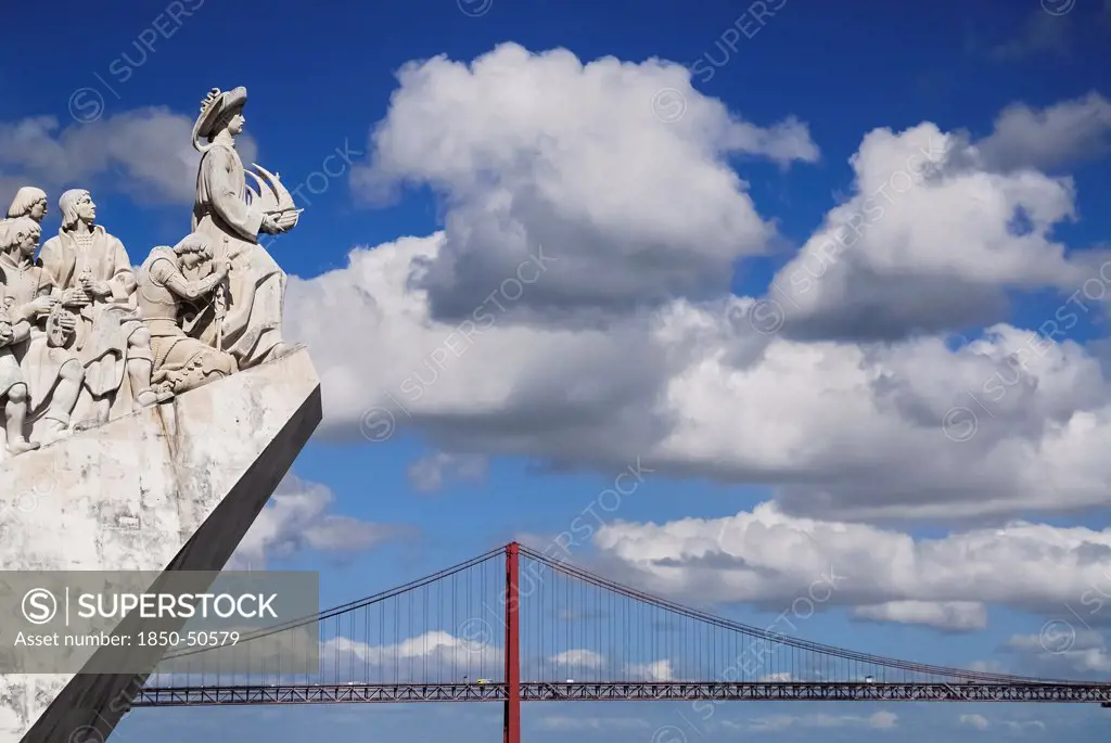 Portugal, Estremadura, Lisbon, Padrao dos Descobrimentos Carving of Prince Henry the Navigator leading the Discoveries Monument with the Ponte 25th Abril Bridge behind.