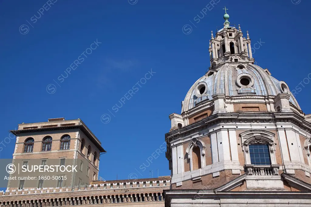 Italy, Lazio, Rome, Exterior of the Palazzo di Venezia museum with church dome in the foreground.