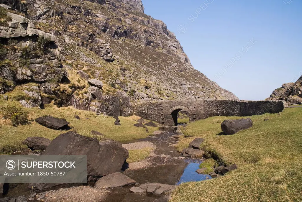 Ireland, County Kerry, Killarney, Gap of Dunloe with old stone bridge crossing mountain stream.