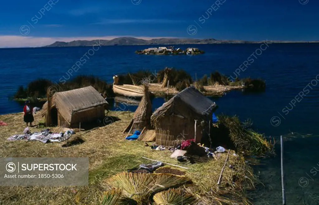 Peru, Puno Administrative Department, Puno, Lake Titicaca.  Reed Houses On Floating Islands Built By The Uros People.