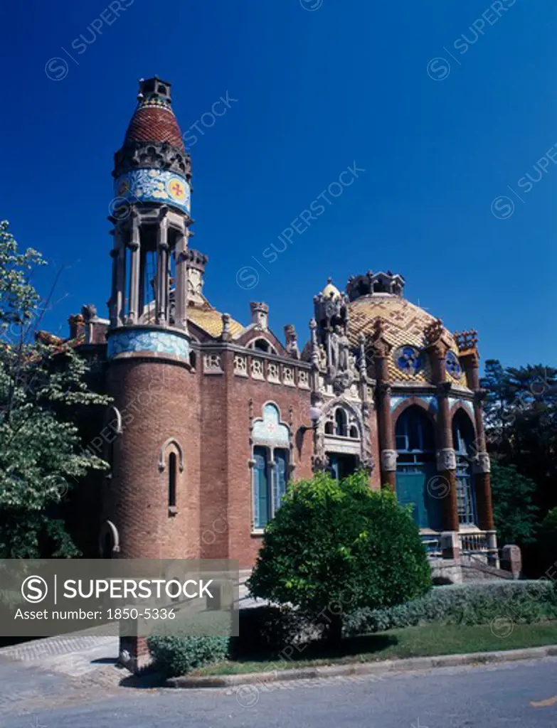 Spain, Catalonia, Barcelona, 'Hospital De Sant Pau Designed By Domenech I Montaner.  Ornate Facade With Arched Windows, Domed Roof And Turret.   '