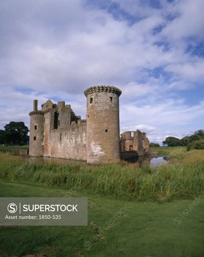 Scotland, Dumfries And Galloway, Caerlaverock Castle Ruins With Surrounding Moat