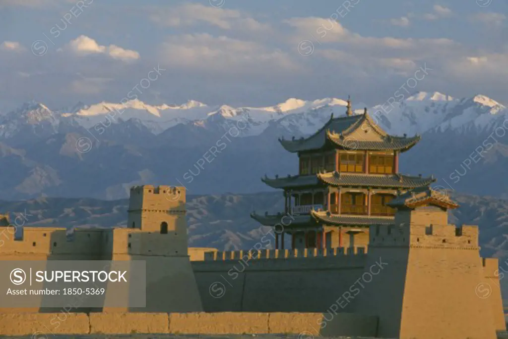 China, Gansu, Jiayuguan, The Fortress At The Western End Of The Great Wall With Snow Capped Mountains Behind
