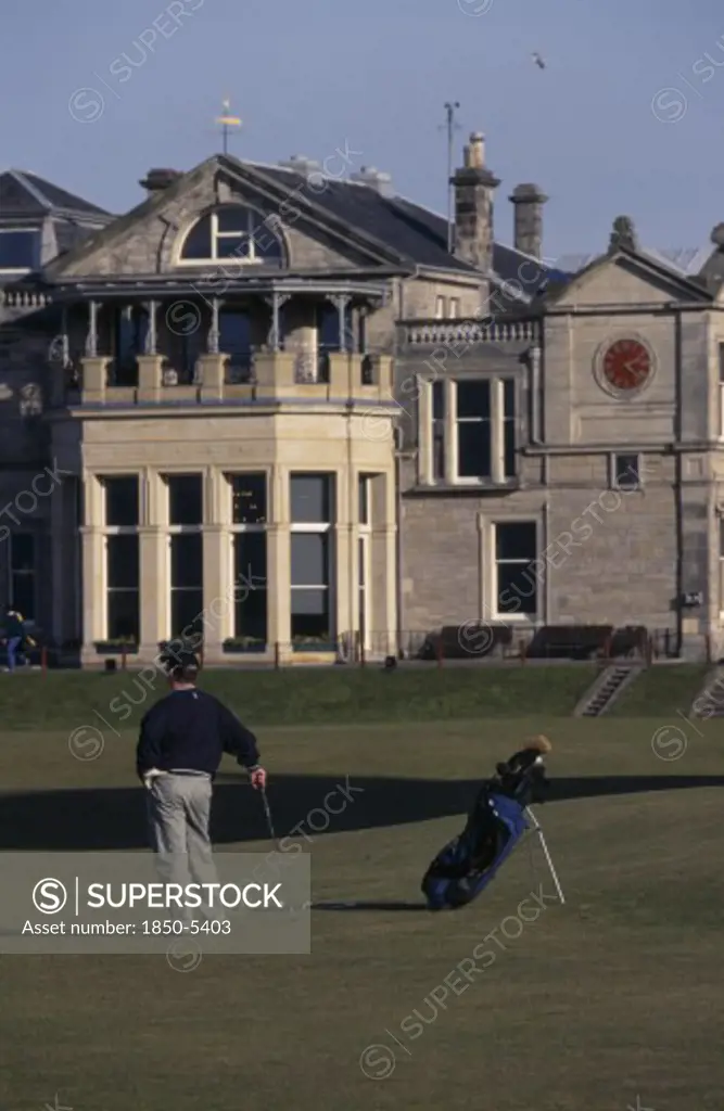 Sport, Ball Games, Golf, Golfer Standing On Green Outside St. Andrews Golf Course Clubhouse