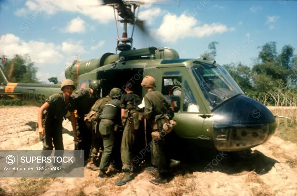Vietnam, War, Booby Trap Marine Dust Off North Of Tam Ky.  Wounded Soldier Being Lifted Into Helicopter.