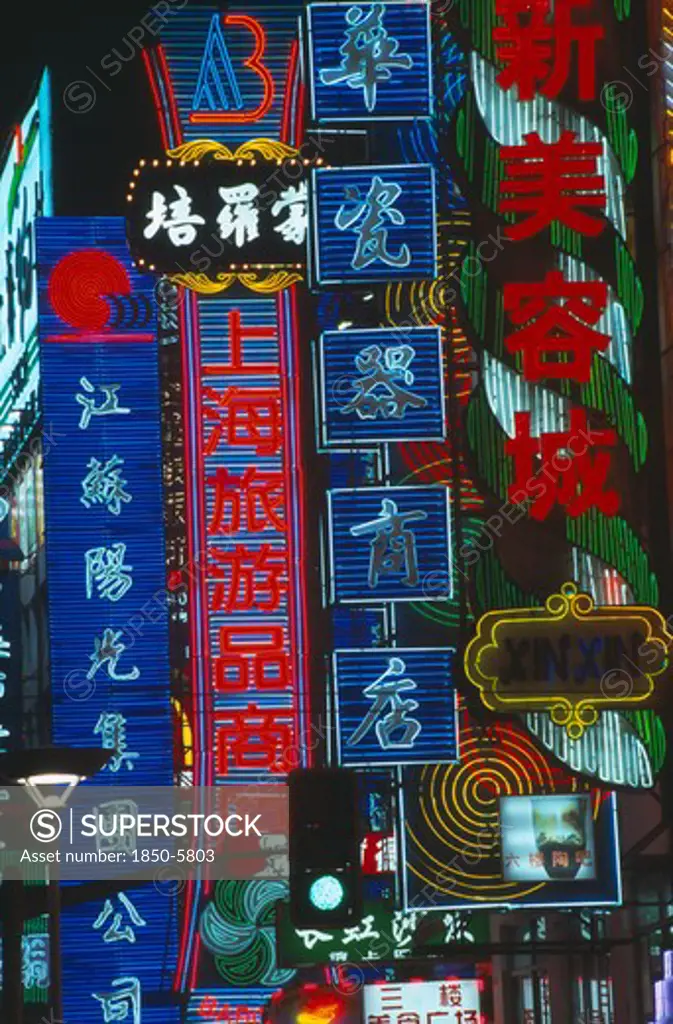 China, Shanghai, Neon Signs Illuminated At Night.
