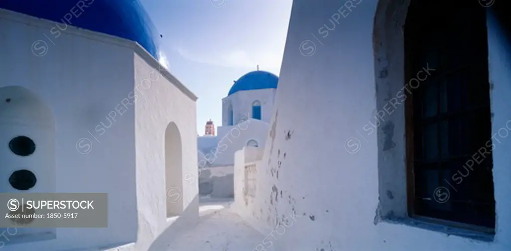 Greece, Cyclades Islands, Santorini, 'Part View Of White Painted Church With Blue, Domed Roof.'