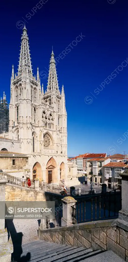 Spain, Castilla Y Leon , Burgos Province, Cathedral.  View From Flight Of Stone Steps In The Foreground Towards Gothic Facade And Twin Spires.